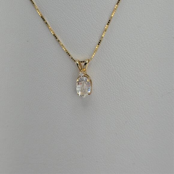 Unbranded Jewelry - 7MM Oval White Topaz, Diamond Pendant Necklace in 14K Polished Yellow Gold 18"